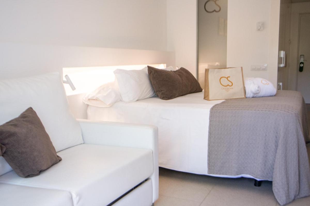 Cama o camas de una habitación en Hotel Cala Saona & Spa