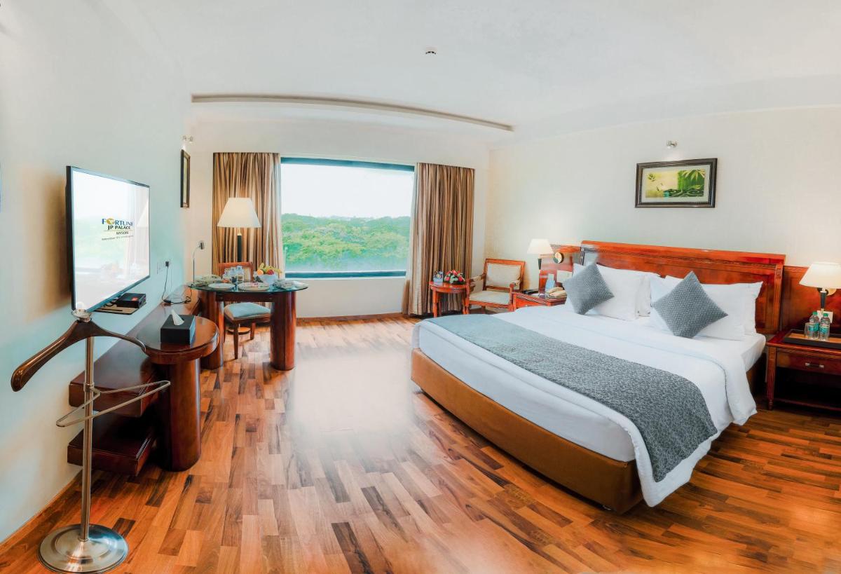 a hotel room with a bed and a television at Fortune JP Palace, Mysore - Member ITC Hotels' Group in Mysore