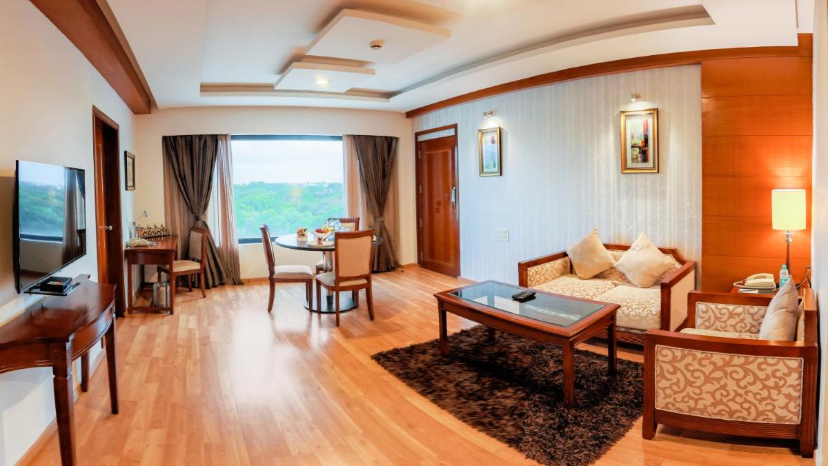a living room with a couch and a table at Fortune JP Palace, Mysore - Member ITC Hotels' Group in Mysore