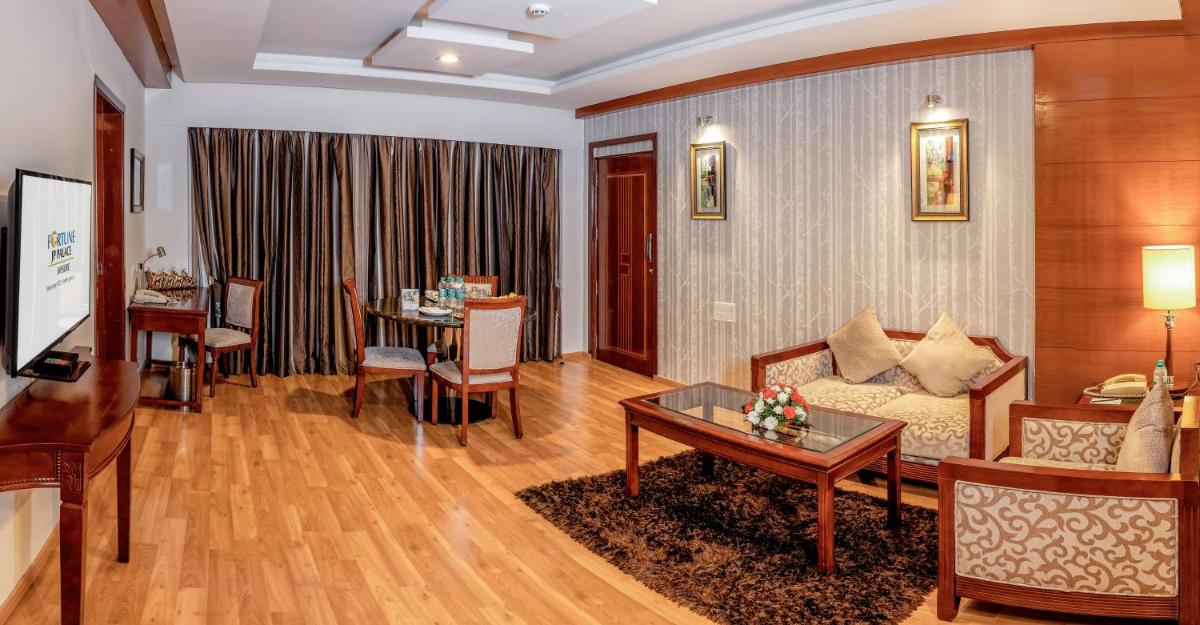 a living room with a couch and a table at Fortune JP Palace, Mysore - Member ITC Hotels' Group in Mysore