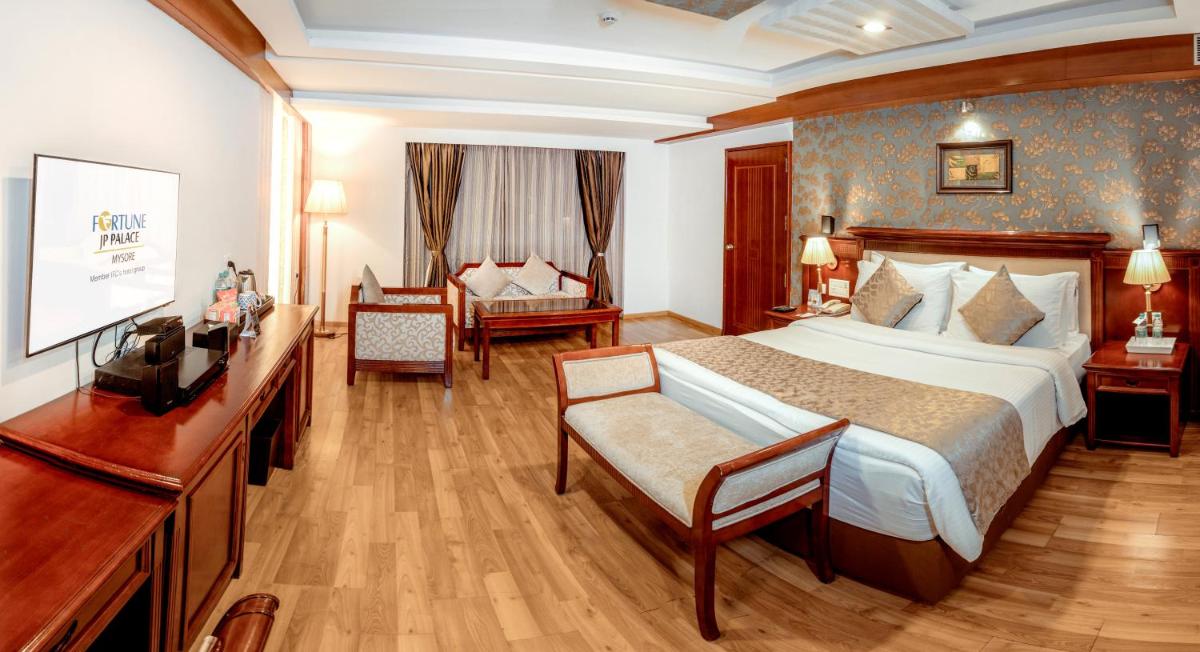 a hotel room with a large bed and a television at Fortune JP Palace, Mysore - Member ITC Hotels' Group in Mysore