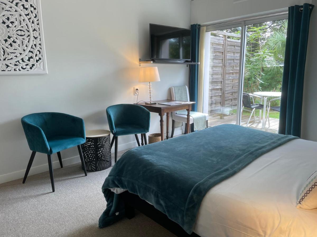 Un ou plusieurs lits dans un hébergement de l'établissement Carnac Lodge Hotel & Spa