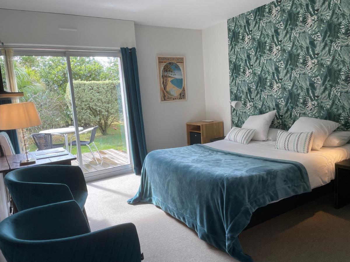 Un ou plusieurs lits dans un hébergement de l'établissement Carnac Lodge Hotel & Spa