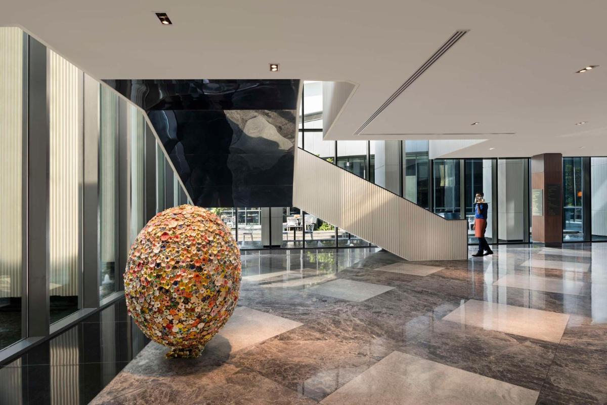 a large vase filled with sprinkles in a building at Hilton Bengaluru Embassy Manyata Business Park in Bengaluru