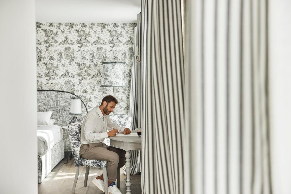 Un ou plusieurs lits dans un hébergement de l'établissement COMO Le Montrachet