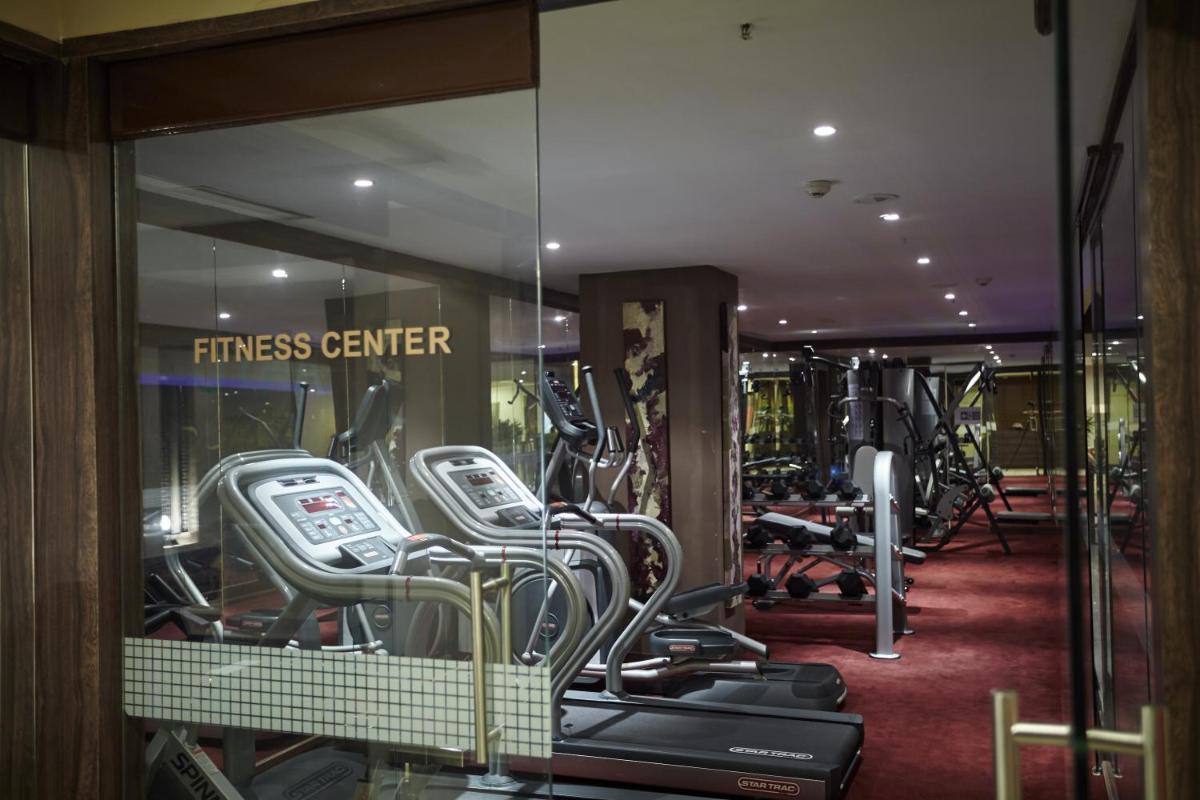 a fitness center with a bunch of exercise bikes at Turyaa Chennai - OMR IT Expressway in Chennai