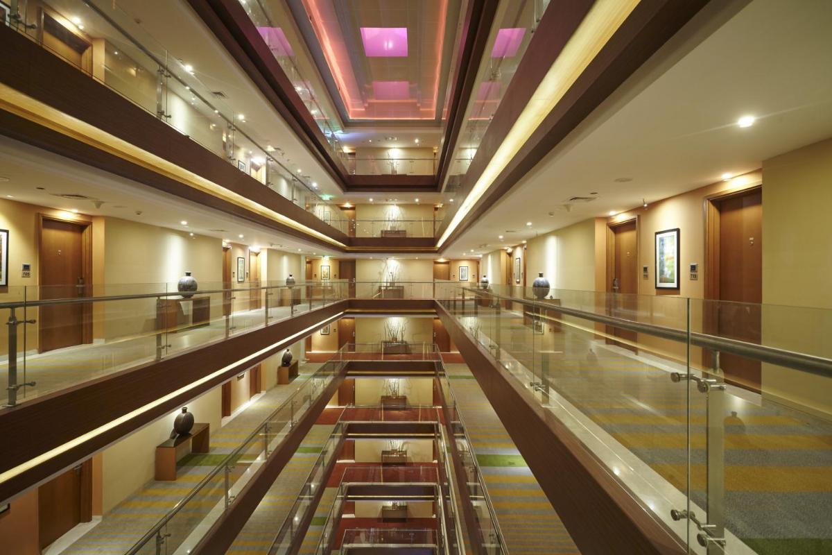 a view of a large building with a ceiling at Turyaa Chennai - OMR IT Expressway in Chennai
