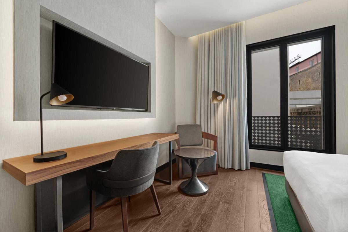 Uma televisão e/ou sistema de entretenimento em Hilton Porto Gaia