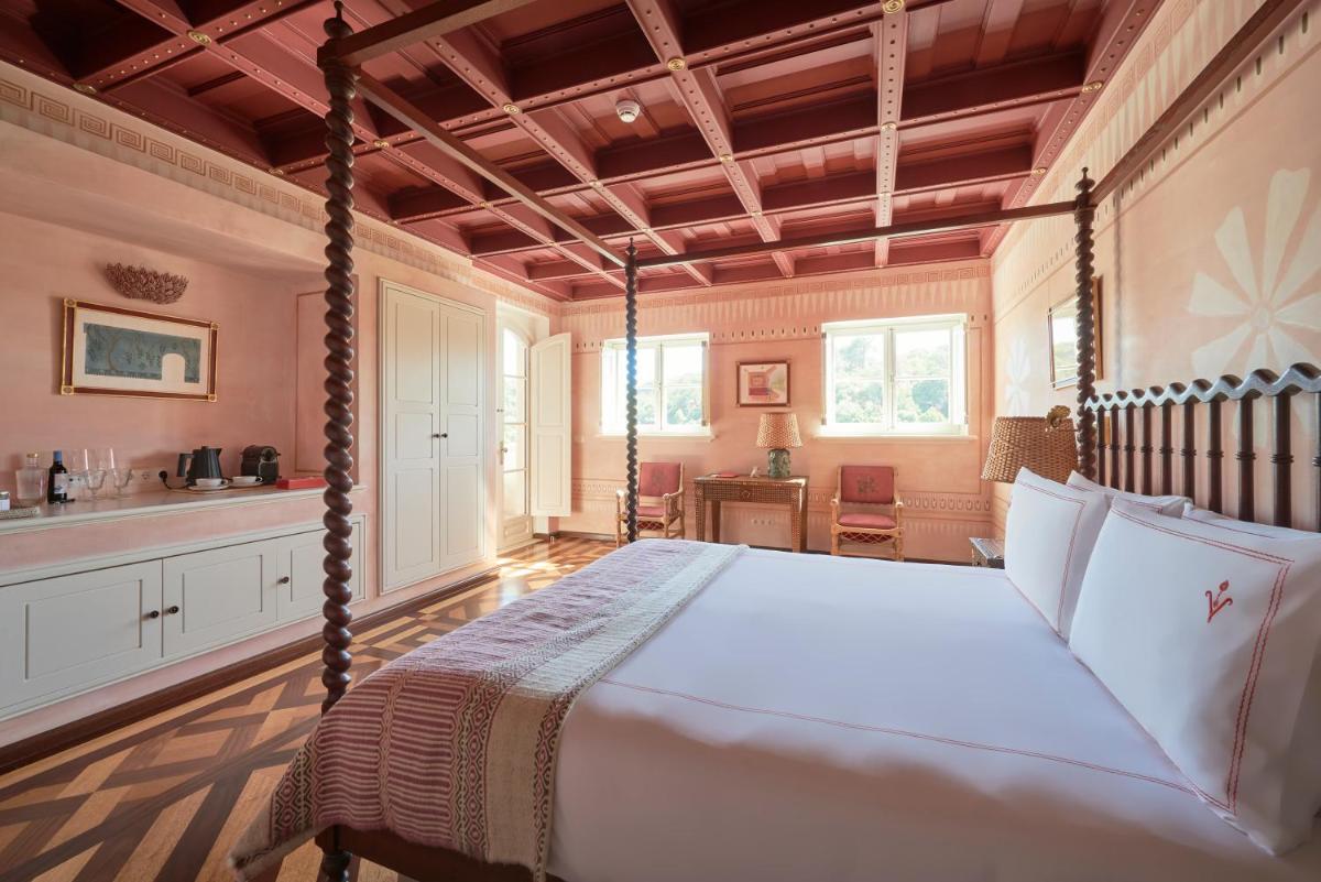 Uma cama ou camas num quarto em Vermelho Melides - Relais & Châteaux