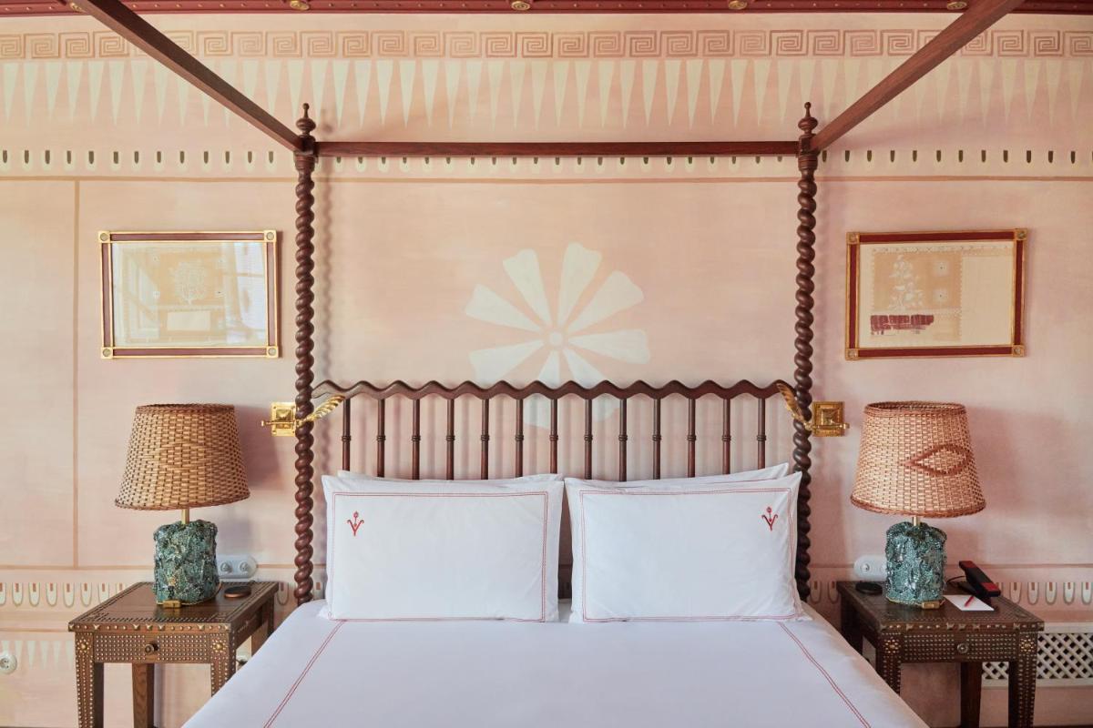 Uma cama ou camas num quarto em Vermelho Melides - Relais & Châteaux