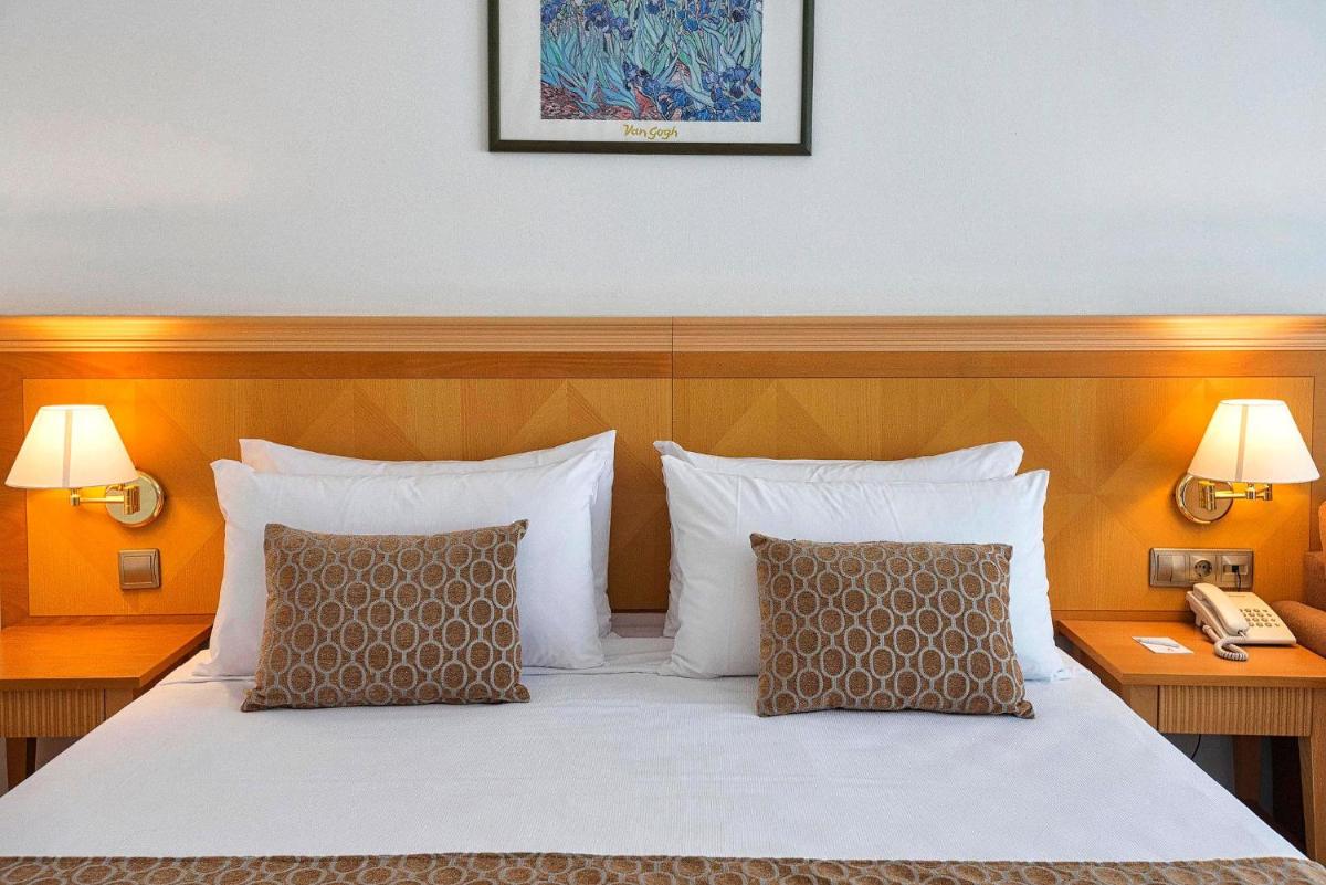 Cama o camas de una habitación en ALEGRIA Costa Ballena Aquafun
