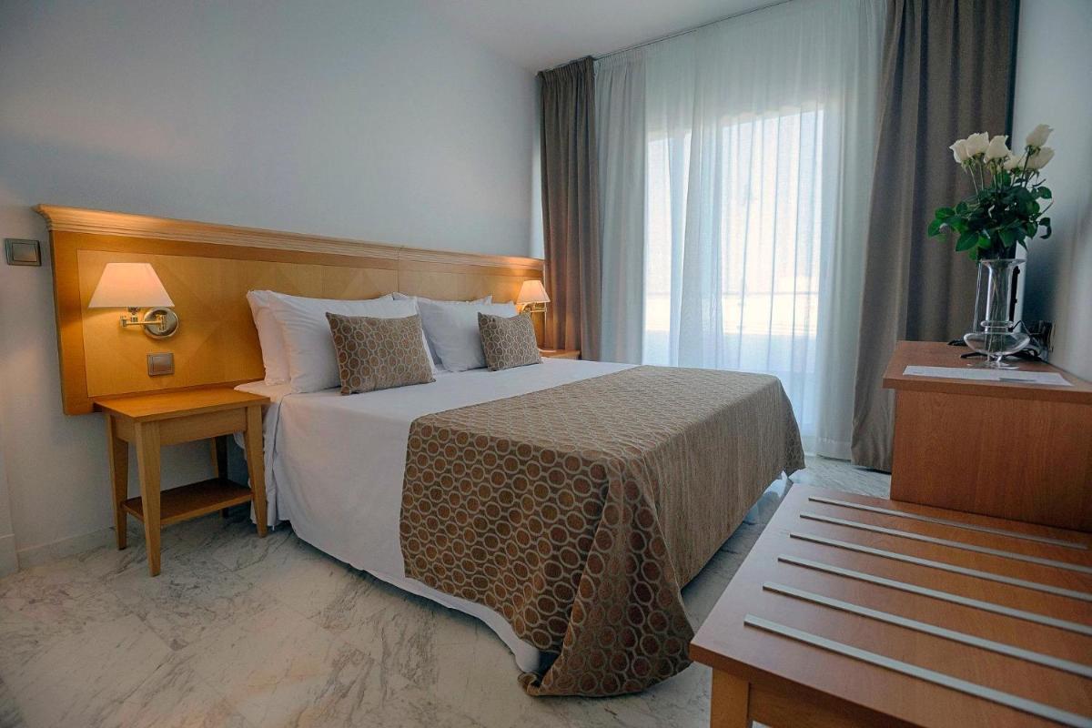 Cama o camas de una habitación en ALEGRIA Costa Ballena Aquafun