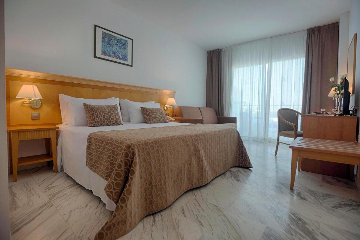Cama o camas de una habitación en ALEGRIA Costa Ballena Aquafun