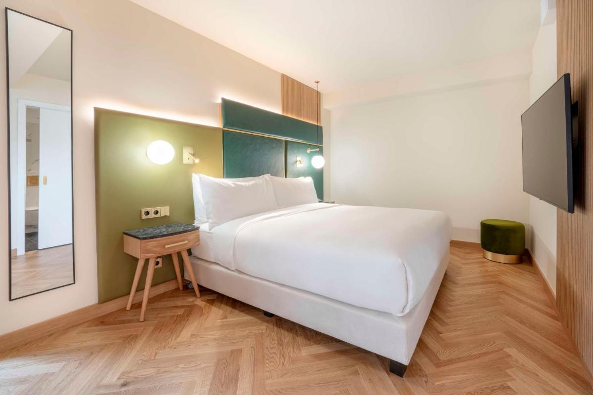 Ein Bett oder Betten in einem Zimmer der Unterkunft Hilton Berlin
