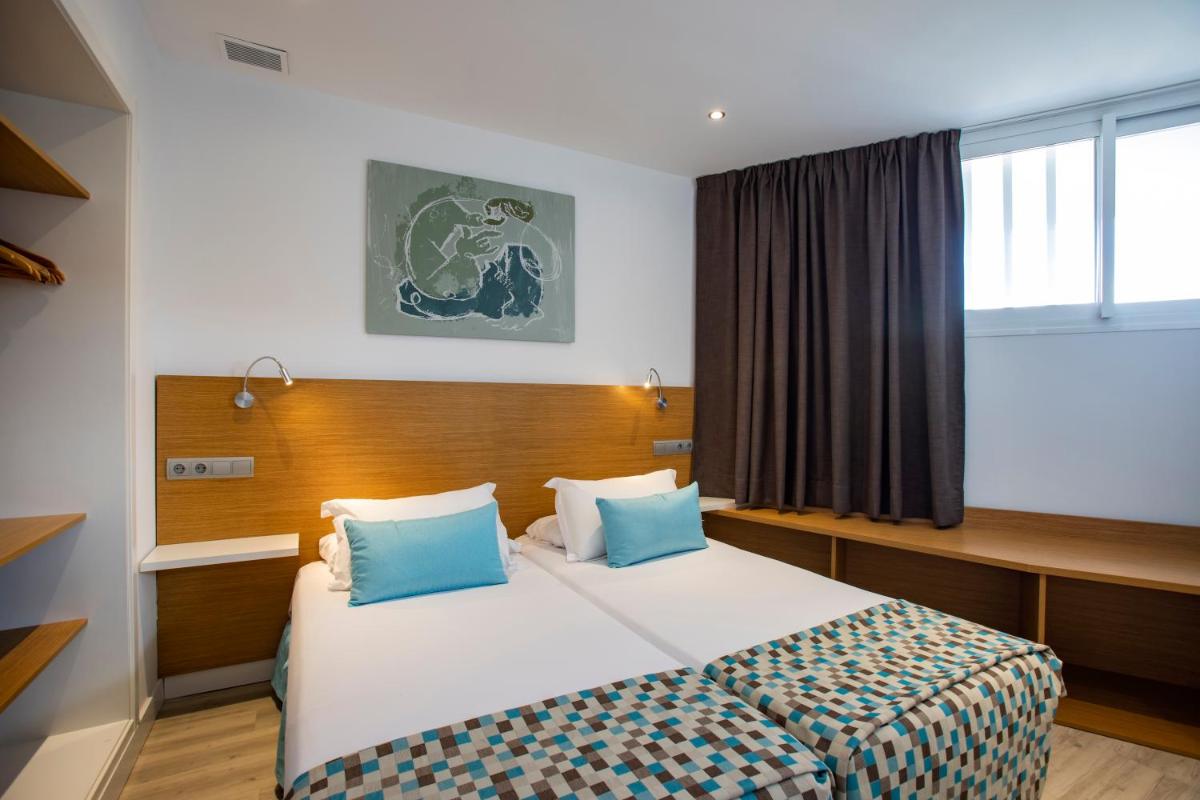 Cama o camas de una habitación en Houm Plaza Son Rigo