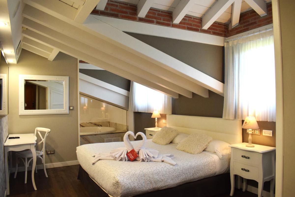 Cama o camas de una habitación en Hotel Spa San Marcos