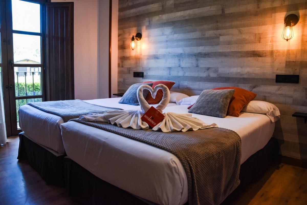 Cama o camas de una habitación en Hotel Spa San Marcos