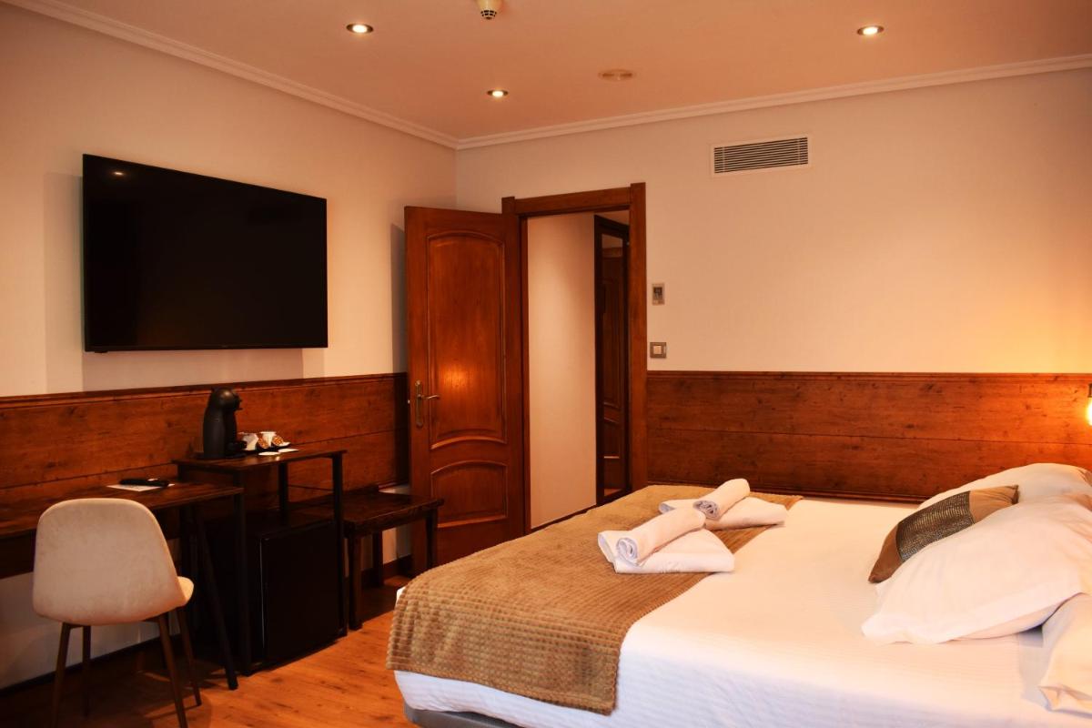 Cama o camas de una habitación en Hotel Spa San Marcos