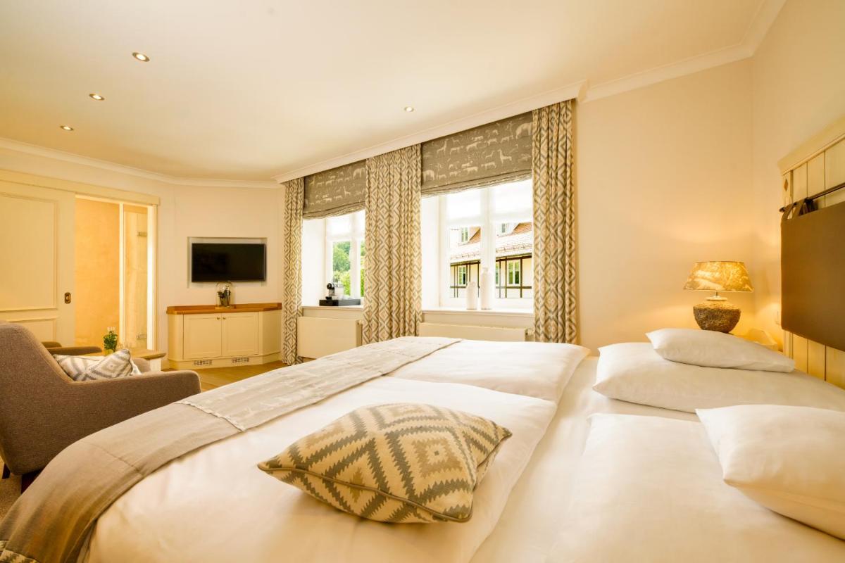 Ein Bett oder Betten in einem Zimmer der Unterkunft Alter Meierhof Glücksburg