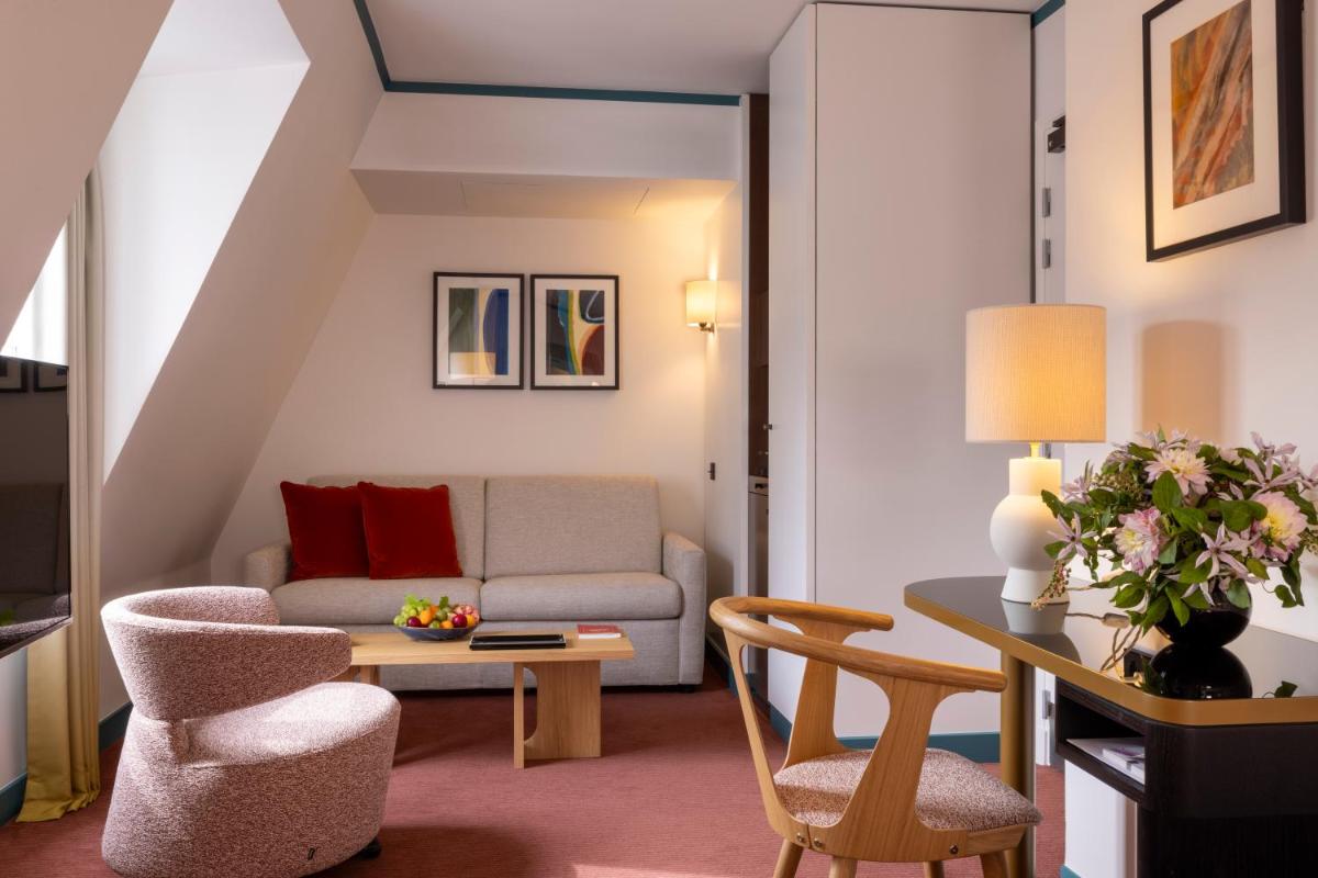 Coin salon dans l'établissement Hôtel Bel Ami