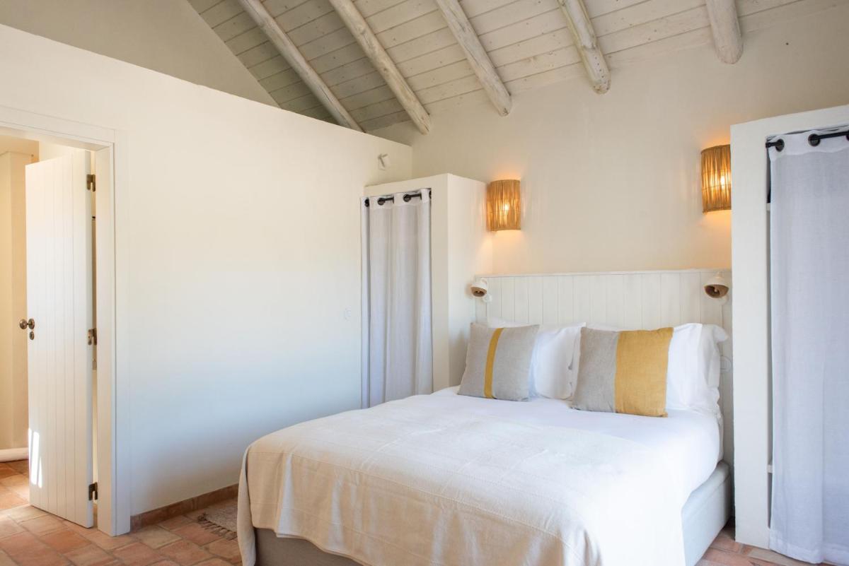 Uma cama ou camas num quarto em Independente Comporta