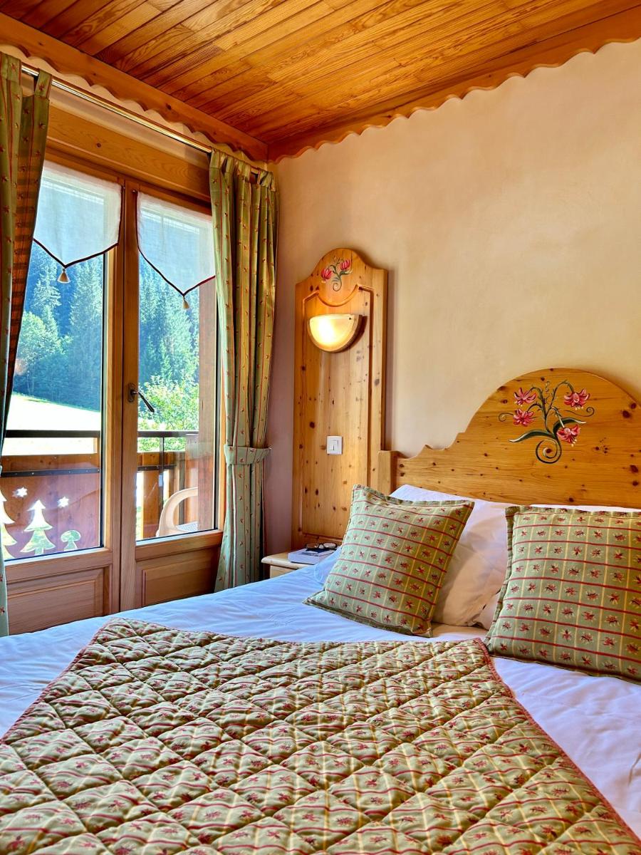 Un ou plusieurs lits dans un hébergement de l'établissement Hameau des Prodains - Hôtel