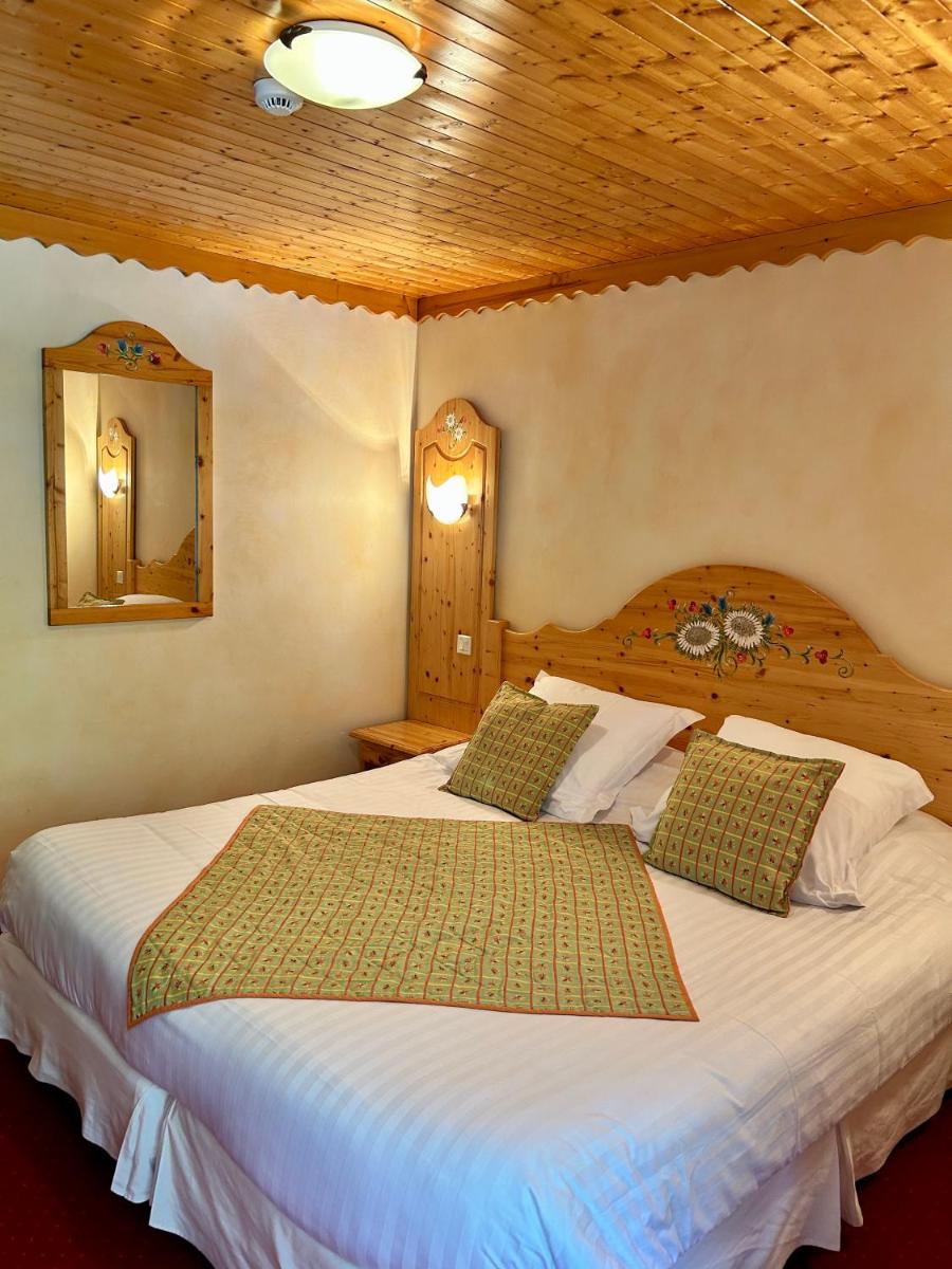 Un ou plusieurs lits dans un hébergement de l'établissement Hameau des Prodains - Hôtel