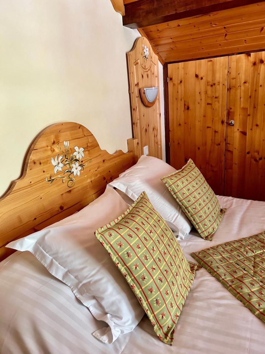 Un ou plusieurs lits dans un hébergement de l'établissement Hameau des Prodains - Hôtel