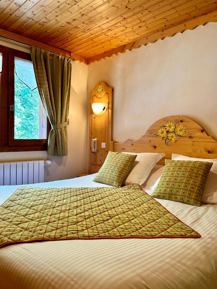 Un ou plusieurs lits dans un hébergement de l'établissement Hameau des Prodains - Hôtel