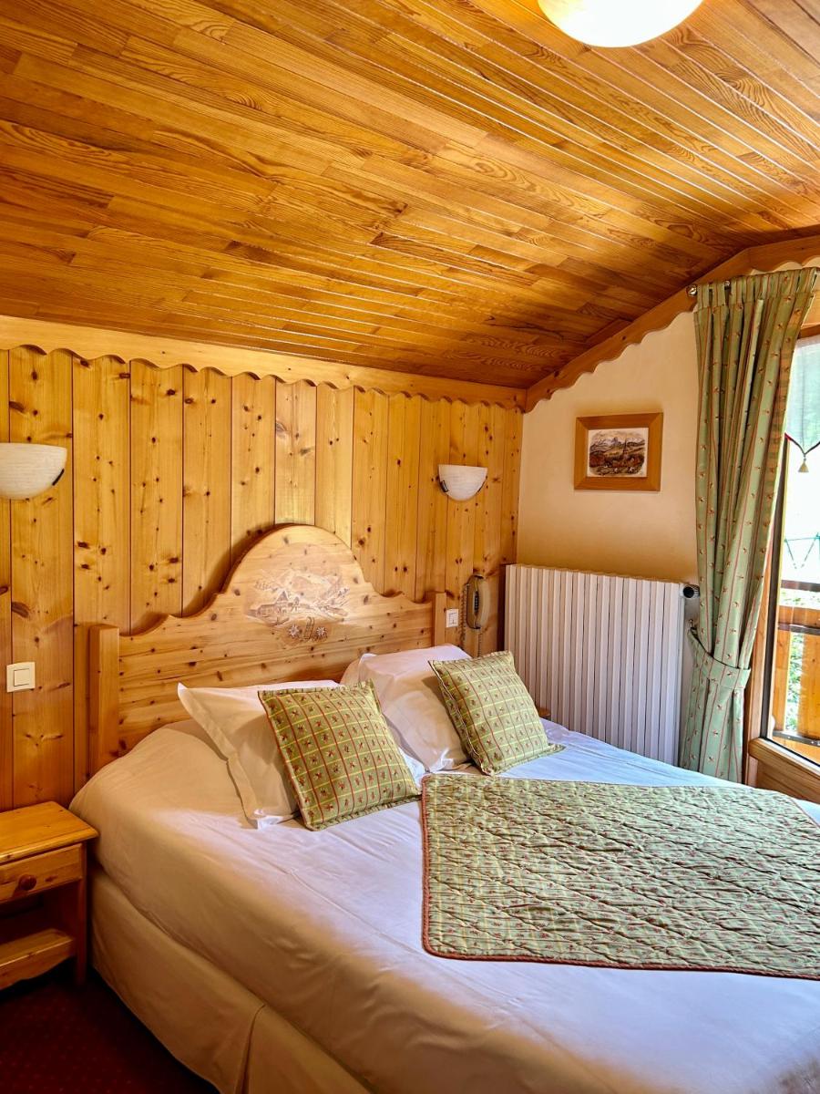 Un ou plusieurs lits dans un hébergement de l'établissement Hameau des Prodains - Hôtel