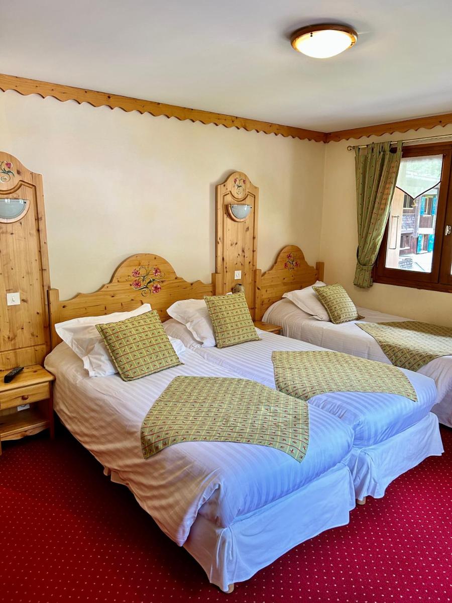 Un ou plusieurs lits dans un hébergement de l'établissement Hameau des Prodains - Hôtel
