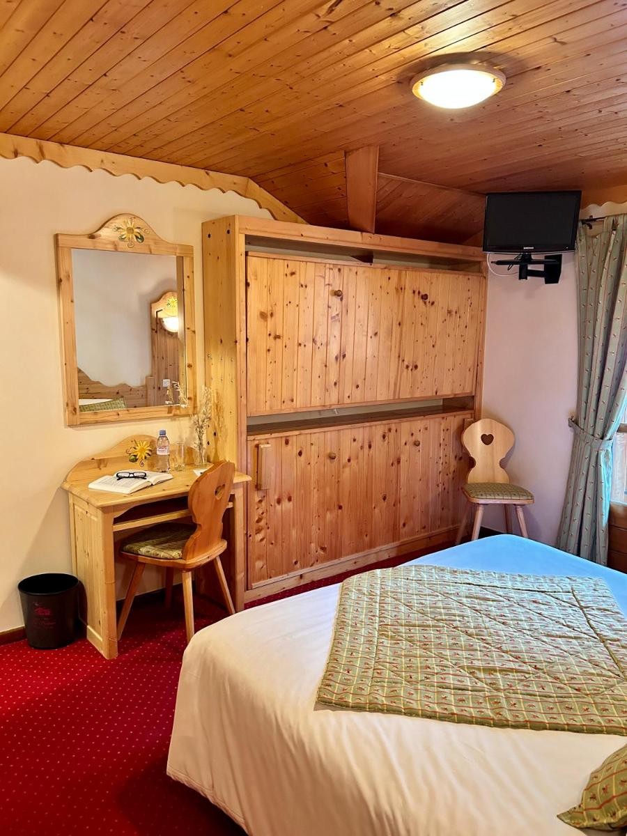 Un ou plusieurs lits dans un hébergement de l'établissement Hameau des Prodains - Hôtel