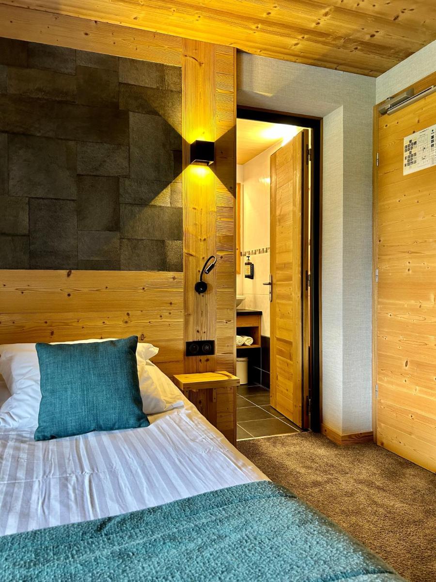 Un ou plusieurs lits dans un hébergement de l'établissement Hameau des Prodains - Hôtel
