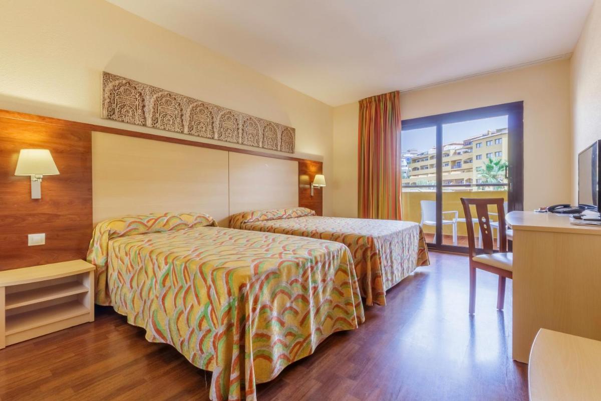 Cama o camas de una habitación en Hotel Best Alcázar