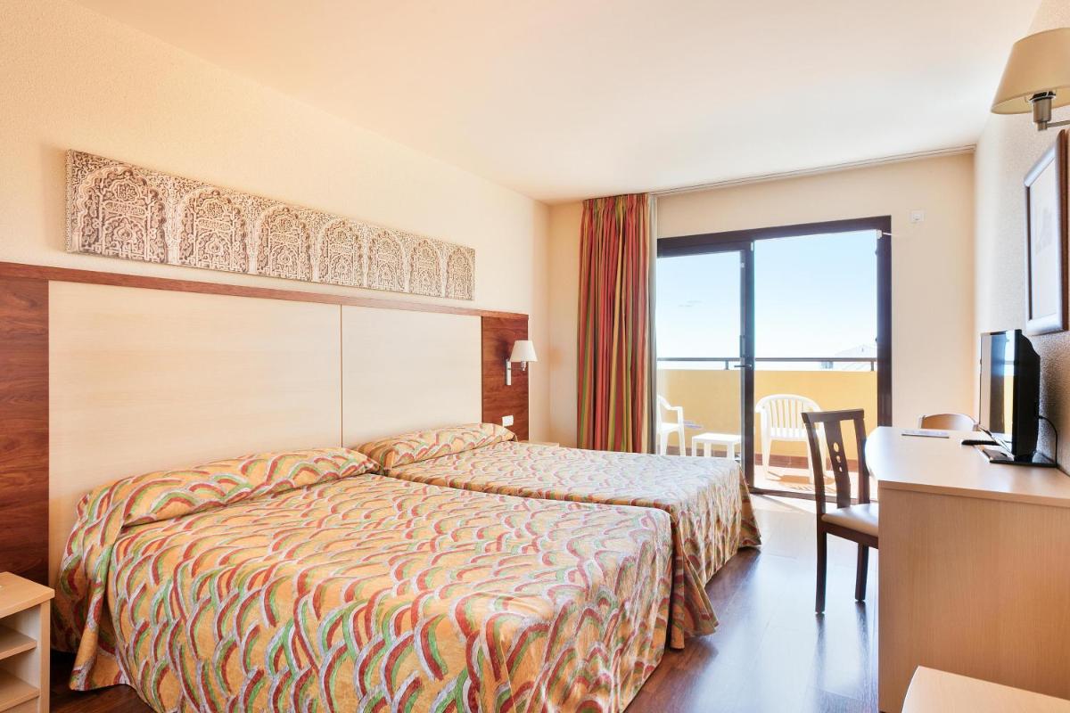Cama o camas de una habitación en Hotel Best Alcázar