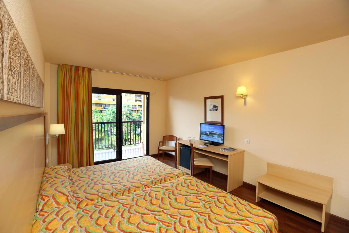 Cama o camas de una habitación en Hotel Best Alcázar