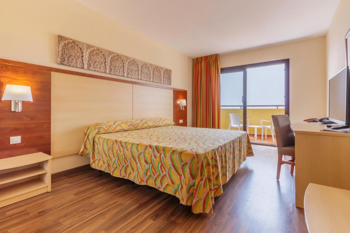 Cama o camas de una habitación en Hotel Best Alcázar