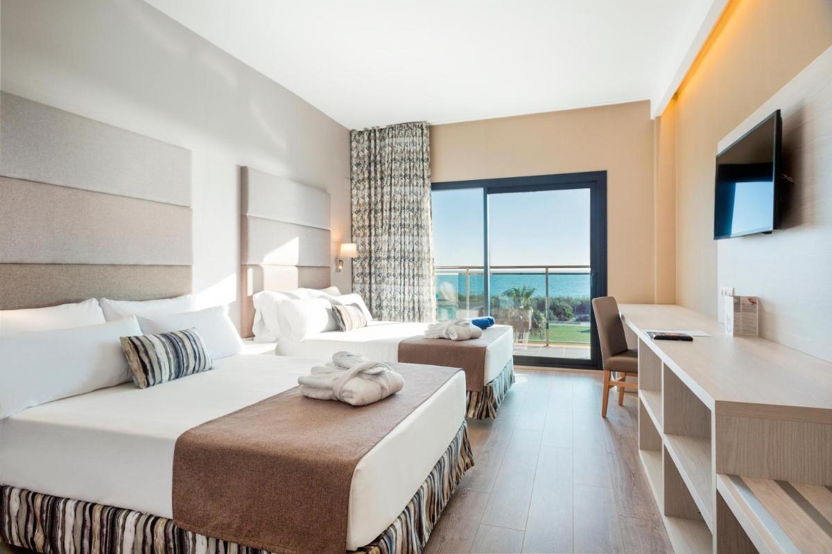 Cama o camas de una habitación en Hotel Best Costa Ballena