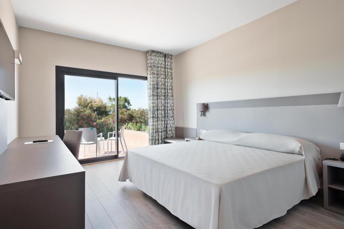 Cama o camas de una habitación en Hotel Best Costa Ballena