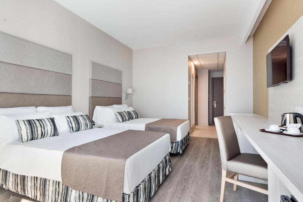 Cama o camas de una habitación en Hotel Best Costa Ballena