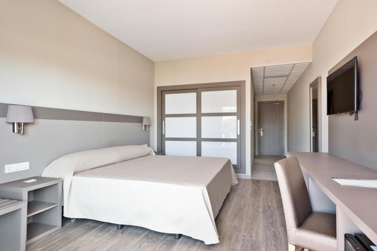 Cama o camas de una habitación en Hotel Best Costa Ballena