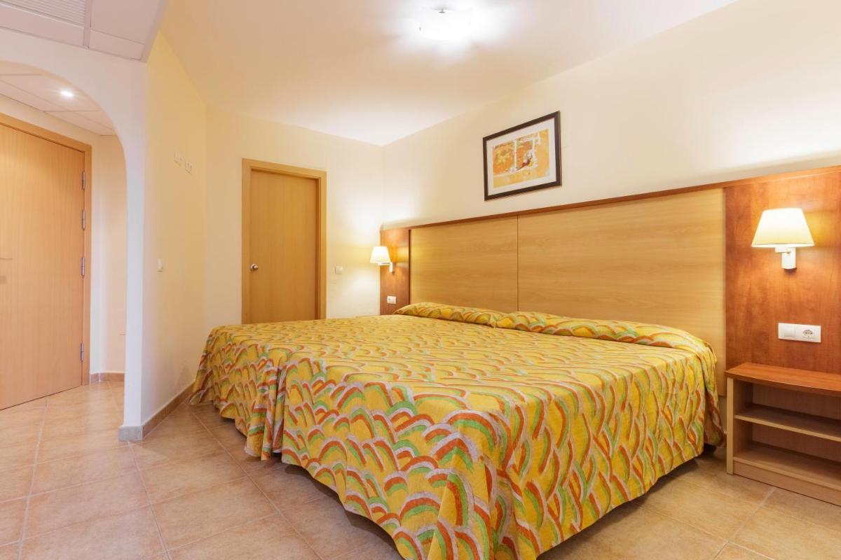 Cama o camas de una habitación en Apartamentos Best Alcazar