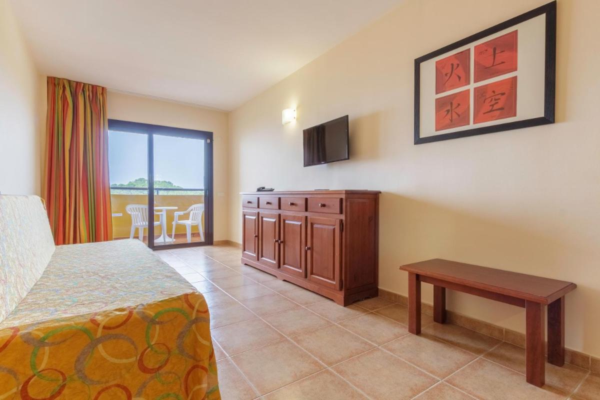 Cama o camas de una habitación en Apartamentos Best Alcazar
