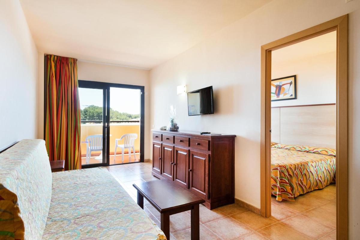 Cama o camas de una habitación en Apartamentos Best Alcazar