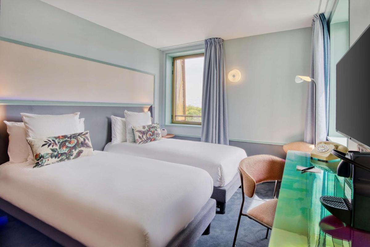 Un ou plusieurs lits dans un hébergement de l'établissement Aiden by Best Western Clermont-Ferrand Hotel & Spa