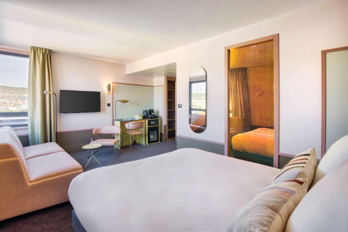 Un ou plusieurs lits dans un hébergement de l'établissement Aiden by Best Western Clermont-Ferrand Hotel & Spa