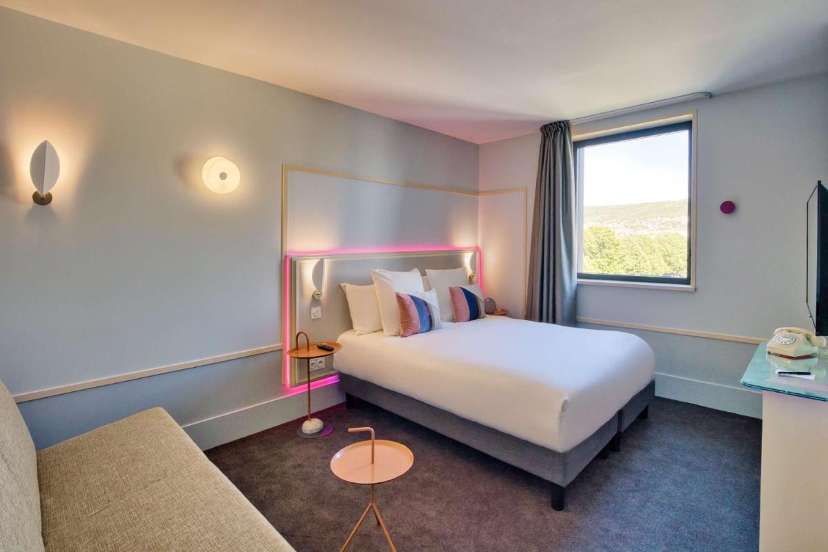 Un ou plusieurs lits dans un hébergement de l'établissement Aiden by Best Western Clermont-Ferrand Hotel & Spa