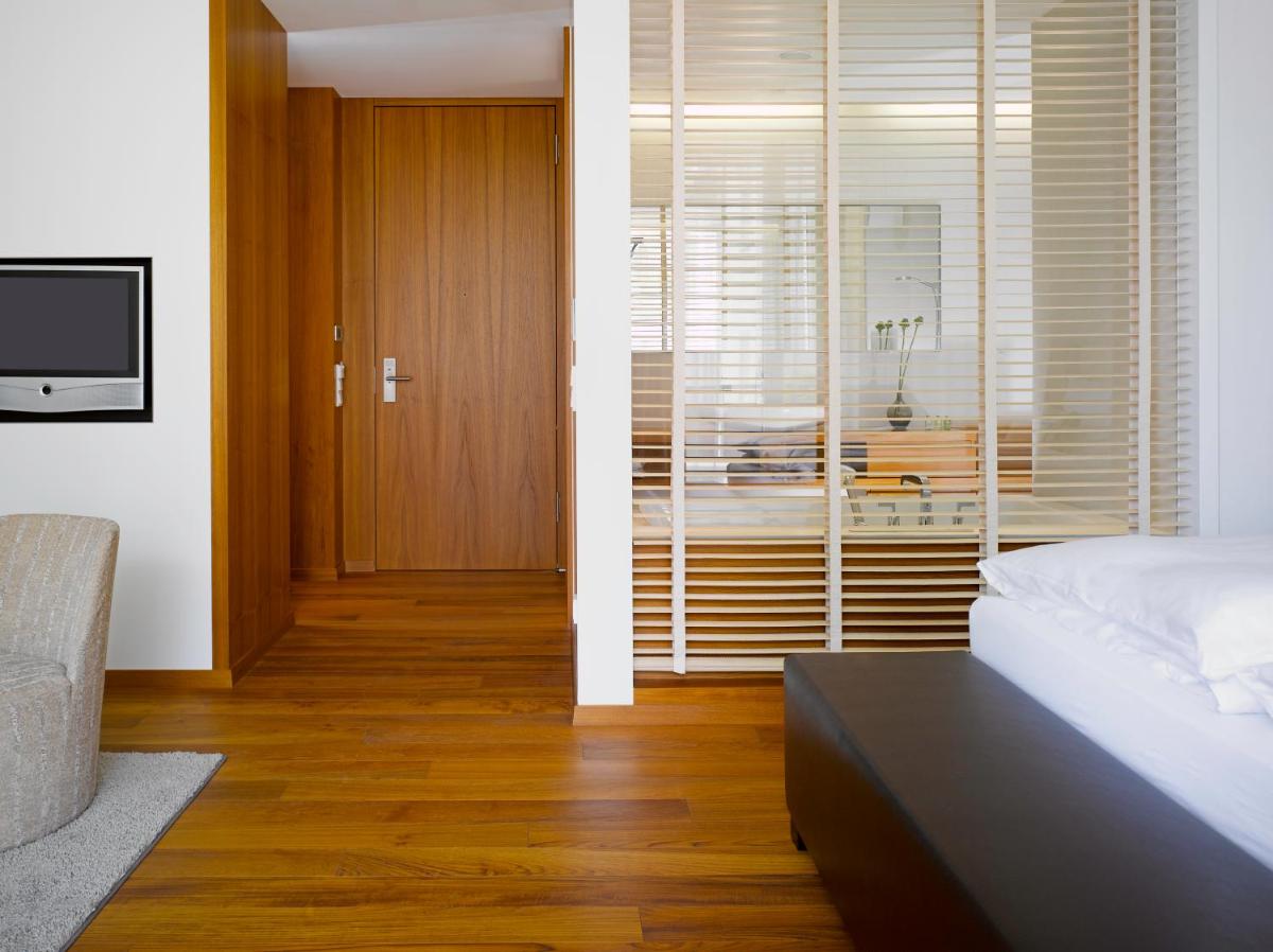 Ein Bett oder Betten in einem Zimmer der Unterkunft RIVA - Das Hotel am Bodensee