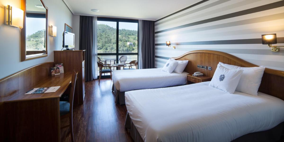 Cama o camas de una habitación en Laias Caldaria hotel y Balneario