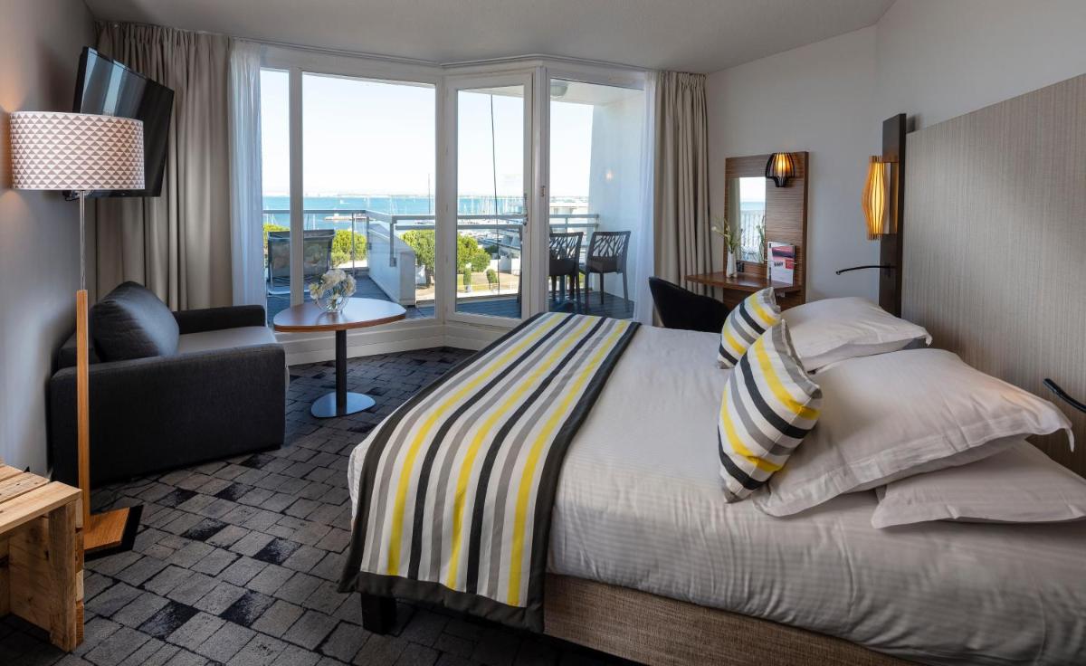 Un ou plusieurs lits dans un hébergement de l'établissement Thalazur Port-Camargue - Hotel & Spa